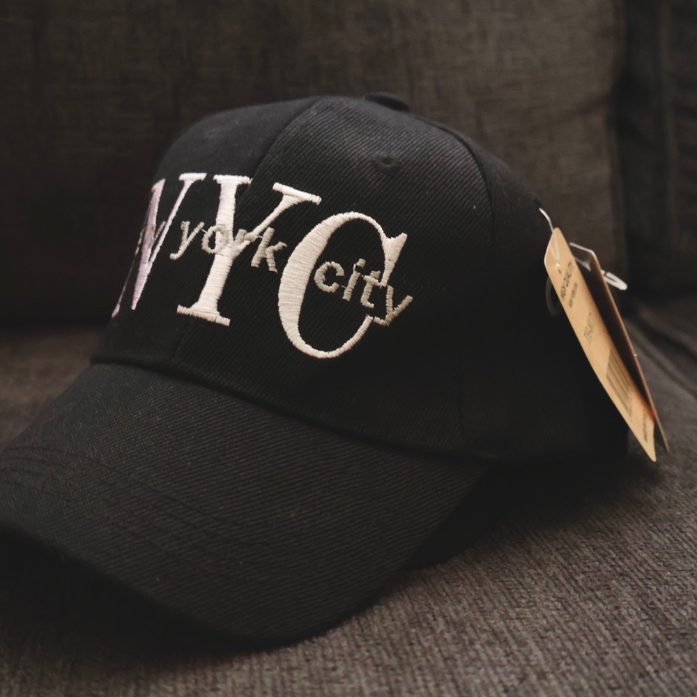 Nyc logo hats available in colors: black/white, navy blue, and all black.